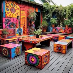 brightly colored benches and tables on a wooden deck