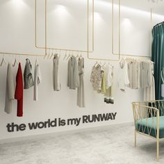 the world is my runway with clothes hanging on racks