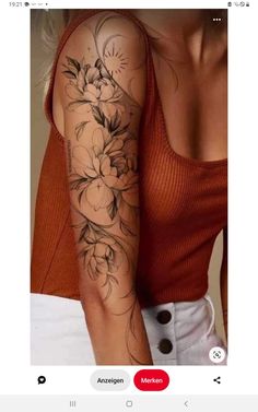 a woman's arm with flowers on it