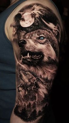 a man's arm with wolf tattoos on it and the moon in the background