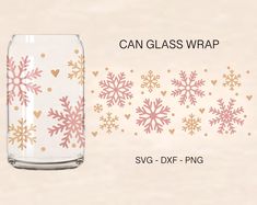 a glass jar with pink and gold snowflakes on it, next to a white background