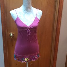 Never Worn, This Tunic Length Cami Is Super Sweet. Pinky/Purply Color With Lace Accents On Chest And Drawstring Empire Waist. Adjustable Straps Make It Fully Customizable. Best Part Is The Embroidered Floral At The Hem. Very Artisan. Size M. Y2k V-neck Tank Top For Spring, Y2k Style Spaghetti Strap Camisole For Spring, Pink Y2k Style Sleeveless Camisole, Cute Fitted Sleeveless Camisole, Cute Fitted Tank Camisole, Fitted Sleeveless Cute Camisole, Summer Y2k V-neck Camisole, Pink Camisole Tank Top For Summer, Cute Fitted Camisole Top