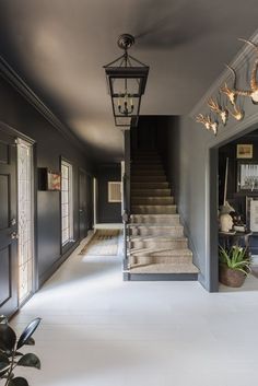 an elegant entry way with stairs leading up to the second floor