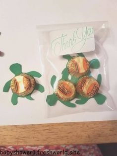 there are four chocolates in the package on the table and one has a sea turtle