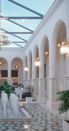 the inside of a building with chandeliers and fountains