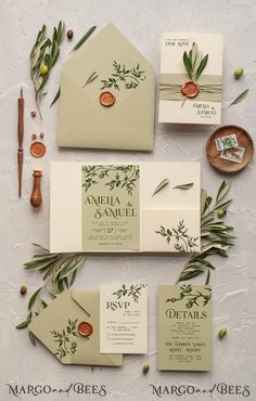 the wedding stationery is laid out on top of each other