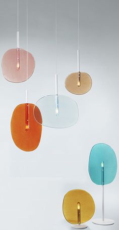 four different colored lights hanging from the ceiling