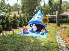 an inflatable play area with sunflowers and other decorations