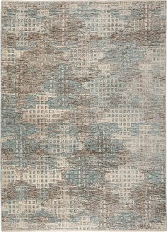 an area rug with various colors and patterns on it, including blue, brown, white and