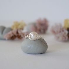 Connect to your inner Goddess with the energies of this uniquely crafted freshwater pearl ring. Our pearl ring is known for: HANDMADE ORIGINAL DESIGN - We customize each pearl ring to the unique shape of its stone. Our ring has an easy to wear, stackable design. Tailor it to fit your mood and style. AUTHENTIC PEARLS & ALLERGY FREE MATERIALS - Your freshwater pearl is authentic and natural. We only use high quality nickel-free, lead-free and allergy-free materials. Ring Specifics: SIZE & MATERIALS - The size of the pearl is 3.5-4 mm. Ring is available in sizes 5 through 11 and in 2 different metal materials: silver plated copper and 925 sterling silver. FEEL THE VIBE OF PEARL - Pearl signifies innocence and faith and is bringing calming effect. Pearl is June's Birthstone and great for Gemin Silver Rings Pearl, Silver Pearl Ring, Silver Ring Designs, Baby Pearls, Freshwater Pearl Ring, Inner Goddess, Pearl Design, Allergy Free, June Birth Stone