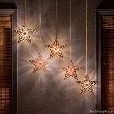 five star shaped lights hanging from the ceiling