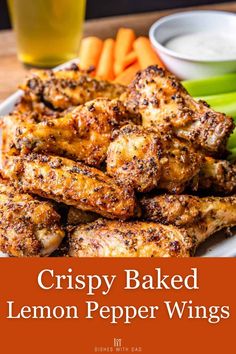 crispy baked lemon pepper wings on a plate with carrots and celery