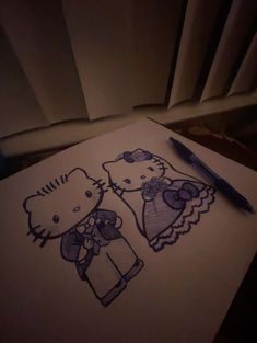 a drawing of two hello kitty characters on paper