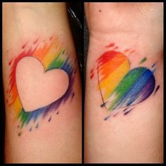 two tattoos with hearts painted on them and one has a rainbow in the middle, while the other has a white heart