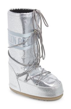 Break up the winter doldrums in cozy-glam style courtesy of this water-resistant, insulated Moon Boot doused with a shimmering flood of silvery glitter. The signature ambidextrous design and crisscrossing tubular laces keep you comfortable and secure no matter where your adventures lead. 14" shaft, 18 1/2" circumference (size 42) Lace-up style Drawcord-toggle cuff Water-resistant Textile and synthetic upper/synthetic lining/rubber sole Imported Silver Moon Boots Outfit, Silver Moon Boots, Moon Boots Outfit, Boots Closet, Ski Fits, 2025 Manifestation, Cozy Glam, Christmas Photoshoot Ideas, Hello Kitty Decorations