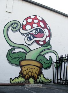 a large mushroom painted on the side of a building