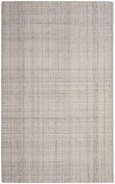 an area rug with grey and white colors