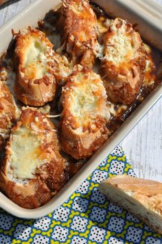 a casserole dish filled with meat and cheese