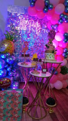 a party with balloons, cake and decorations