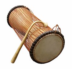 an african drum with a wooden stick sticking out of it