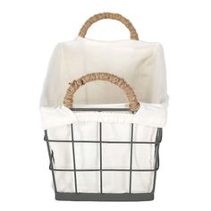 a white and black basket with rope handles