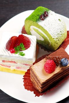 three different desserts on a white plate