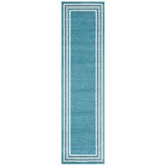 a blue runner rug with white border