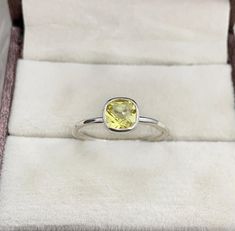 This Ring comes with a 100% Natural Lemon Quartz Gemstone and it is made up of 925 solid sterling silver. This ring is handcrafted by our skilled craftsmen and designed by us. Every gemstone is handpicked for the best quality.  Materials:- Silver (925 Solid Sterling Silver) Item Weight :- approx. 2 Grams Gemstone:- Natural Lemon Quartz Stone Size :- 06 MM Stone Shape :- Cushion Cut Select Size in Variation , if you don't find perfect size please buy any size and message us your size we'll make. Lemon Quartz Ring, Fantasy Ring, Bezel Ring, Lemon Quartz, Quartz Ring, Quartz Stone, Birthstone Ring, Stackable Rings, Cushion Cut