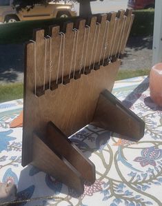 a wooden book stand on top of a table