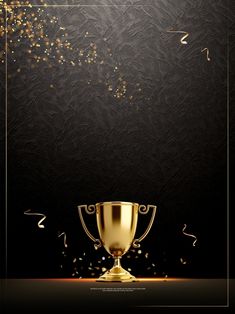 a golden trophy sitting on top of a table next to confetti and streamers