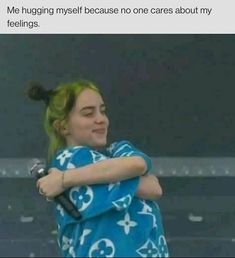 a girl with green hair hugging her arms and looking at the camera, text reads me hugging my self because no one cares about my feelings