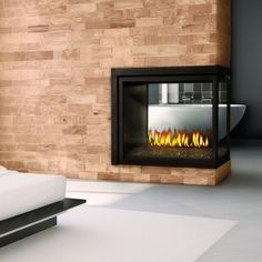 a bedroom with a bed and a fire place in the wall next to each other