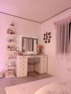 a bedroom with a desk, mirror and lights