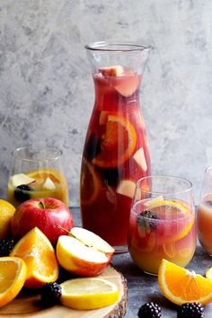 an assortment of fruit and juices in glasses on a table with the words virgin sangria