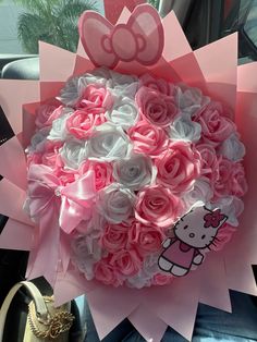 a hello kitty bouquet in someone's car