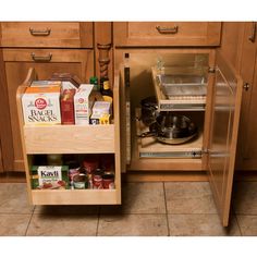 an open cabinet in a kitchen filled with food