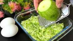 someone is grating an avocado in a bowl