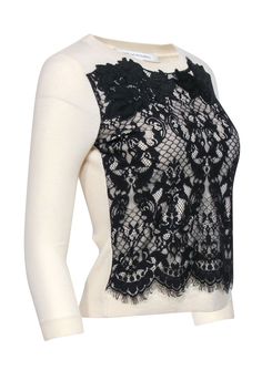 A festive or mysterious lace sweater by Diane von Furstenberg; you decide the mood with the occasion! This classic fit sweater pairs perfectly with cropped black pants and a black pump for a chic take on holiday party dressing, or with a leather pencil skirt for a look that is both pretty and edgy. Size P 90% Wool, 8% Nylon, 2% Spandex Combo 100% Nylon Lace overlay detail Ribbed back Bust 33" Waist 29" Shoulder to hem 20.5" Sleeve length 19.5" Elegant Sweater For Night Out In Spring, Elegant Spring Sweater For Night Out, Elegant Black Tops With Contrast Lace, Elegant Fitted Sweater With Lace Trim, Elegant Stretch Sweater For Party, Elegant Black Lace Top For Layering, Fitted Fall Sweater With Lace Trim, Black Crew Neck Sweater For Evening, Winter Crew Neck Sweater With Lace Trim