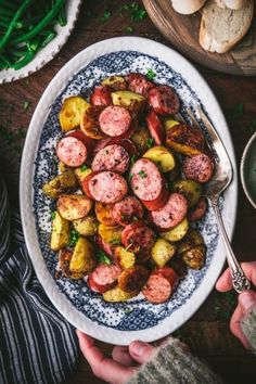 a plate full of cooked sausage and potatoes