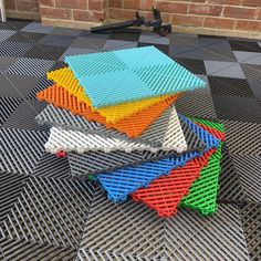 a stack of legos sitting on top of a metal grate