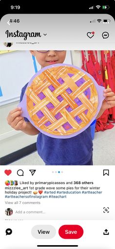 the instagram page on instagram shows an image of a child holding up a pie