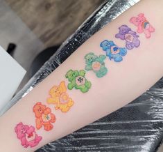 a person with a tattoo on their arm that has teddy bears painted on it