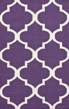 purple and white rug with an intricate design