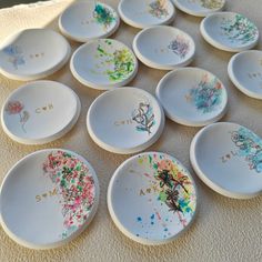 many white plates with different designs on them