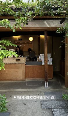 a coffee shop with people sitting at the counter