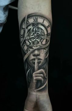 a person's arm with a clock on it and a hand holding a finger