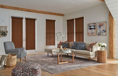 a living room filled with furniture and wooden floors