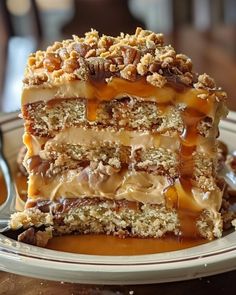 a piece of cake sitting on top of a plate covered in caramel and pecans