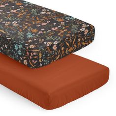 two bedspreads, one with an orange sheet and the other with floral print