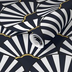 an artistic wallpaper design with black and white fan shaped designs on the side of it